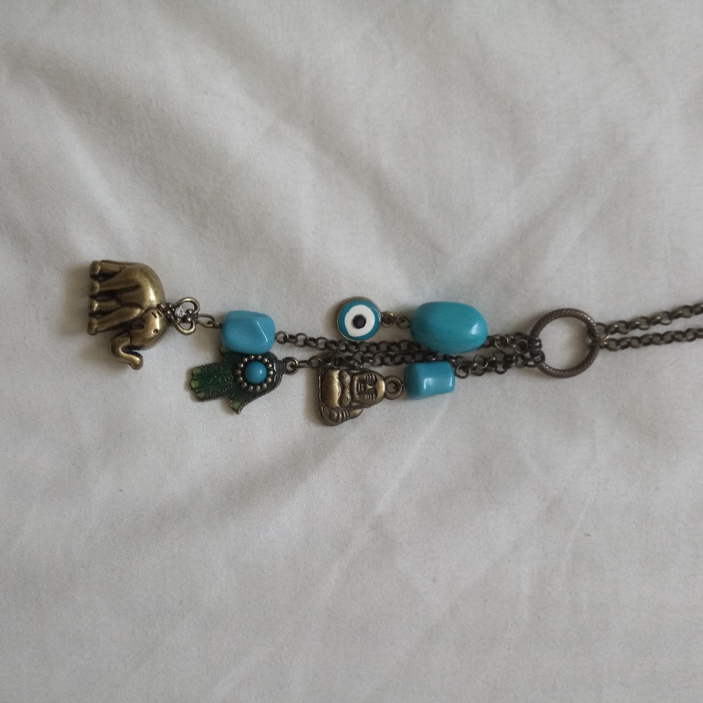 Blue and gold necklace on long chain